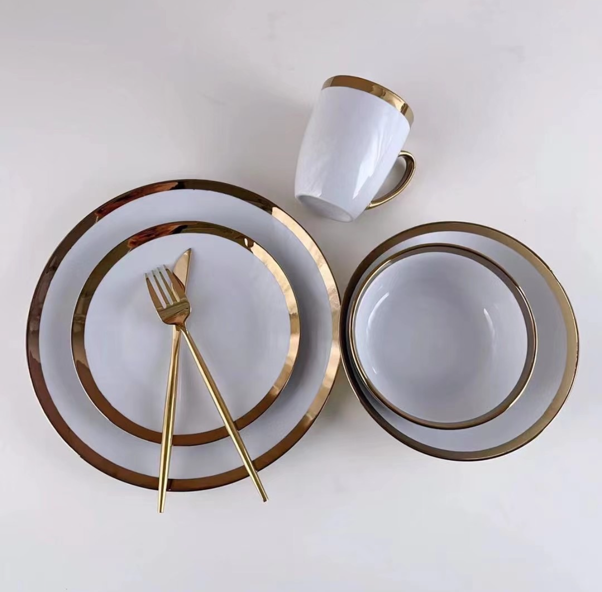 "Elevate Your Dining Experience with Our Chic White and Gold Tableware Collection"